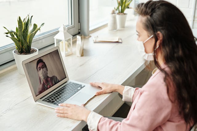 Woman consuling with healthcare provider via telemedicine platform